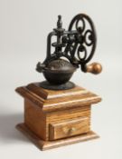 AN OLD COFFEE GRINDER