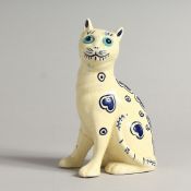 A SMALL GALLE STYLE POTTERY MODEL OF A CAT. 6ins high