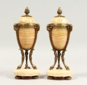 A GOOD PAIR OF 19TH CENTURY FRENCH MARBLE CASSOLETS with ormolu mounts and hoof feet. 10ins high
