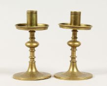 A SMALL PAIR OF BRASS TAPER OR CANDLESTICKS 4ins high