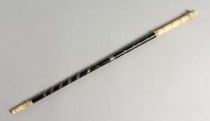 A GOOD IVORY AND EBONY INLAID BATON 20ins long