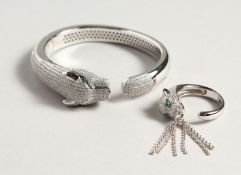 A SILVER PANTHER BANGLE AND RING.