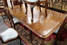 A GOOD VICTORIAN MAHOGANY EXTENDING DINING TABLE with 2 leaves on turned legs with castors. 9ft 8
