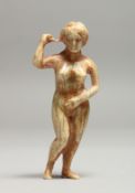 AN EARLY CARVED BONE NUDE 3ins long