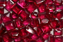 A BOX OF RUBY BUFF STONES