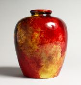 A ROYAL DAULTON FLAMBE GLAZED BULBOUS SHAPED VASE, initialled H N. 8.5ins high