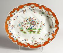 A LARGE FLORAL DECORATED TREE AND WELL CARVING DISH 20.5ins wide