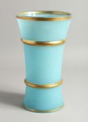 A LIGHT BLUE GLASS VASE with gilt band.