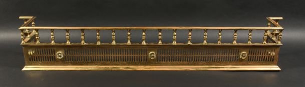 A VERY GOOD 19TH CENTURY BRASS FENDER of Adam design with turned gallery, pierced front. 4ft 11ins