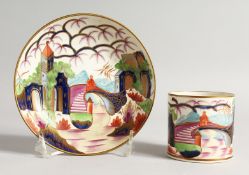 A 19TH CENTURY PORCELAIN COFFEE CAN AND SAUCER painted in the imari style.