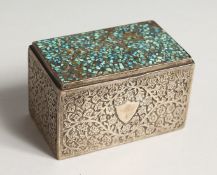 AN ISLAMIC SILVER BOX, the lid with turquoise mosaic 3.5ins