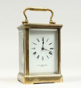 A FRENCH BRASS CARRIAGE CLOCK retailed by MALLETT & SON, BATH. 52ins high The reverse is stamped