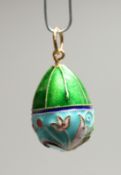 A RUSSIAN SILVER AND ENAMEL EGG PENDANT.