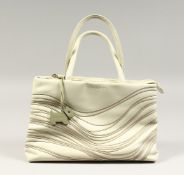 A RADLEY CREAM HANDBAG with dust cover