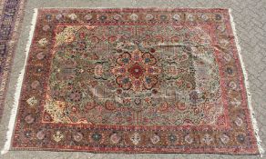 A LARGE PERSIAN TABRIZ CARPET, pale green ground with all over stylised floral decoration within a