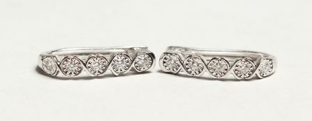 A PAIR OF 18CT WHITE GOLD AND DIAMOND HOOP EARRINGS. Diamonds approx.0.25ct.