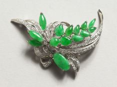 A SUPERB DIAMOND AND JADE FLORAL BROOCH set in18ct white gold