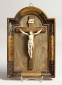 A SMALL 18TH CENTURY CARVED IVORY CORPUS CHRISTI. 5ft long on a gilded frame 12ins x 8ins