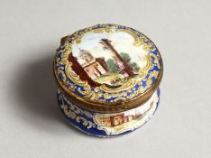 A BATTERSEA ENAMEL CIRCULAR SNUFF BOX the lid with a ruin 1.5ins diameter
