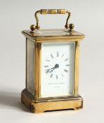 A 19TH CENTURY FRENCH BRASS CARRIAGE CLOCK retailed by Matthew Newman, London. 3.75ins high