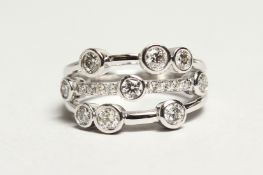 AN 18CT WHITE GOLD AND DIAMOND 'BUBBLE' RING, the diamonds of approx. 1ct. in total Ring size N