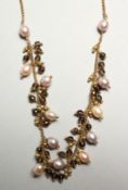 AN 18CT. YELLOW GOLD, FRESHWATER PEARL AND SMOKEY QUARTZ NECKLACE. 40cm long