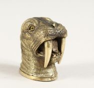 A BRASS WALRUS VESTA