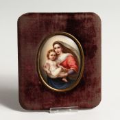 A 19TH CENTURY PORCELAIN MINIATURE MADONNA AND CHILD 3ins x 2.5ins in a velvet frame.