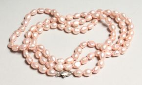 A SET OF SILVER CLASP PEARLS