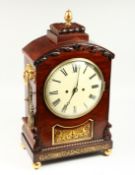 A GOOD REGENCY ROSEWOOD BRACKET CLOCK with brass inlay acorn final, circular dial, 8 day movement,