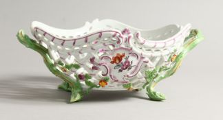 A GOOD MEISSEN PORCELAIN SHAPED AND PIERCED TWO HANDLED BASKET painted with flowers. Cross swords