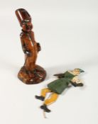 A CARVED TREEN FIGURAL PIPE and stand, 8.5ins high, and a puppet (2)