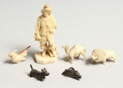 A SMALL EUROPEAN CARVED IVORY MAN CARRYING A HORN 3ins high and a lion, a camel, bird, and dog. (5)