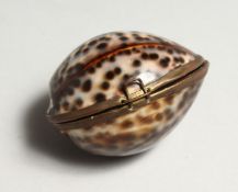 A SMALL PURSE MADE FROM A SHELL 2.5ins wide