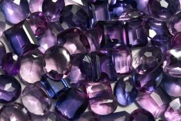 A BOX OF KUNZIT AND AMETHYST STONES