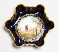 A VIENNA PORCELAIN BOWL AND COVER, apple finial. Beehive mark in puce, No. 24 4.5ins high.