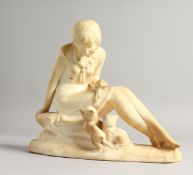 AN ART DECO MOULDED PLASTER MODEL OF A SEATED FEMALE FIGURE, two kittens by her side. 8.75ins high.