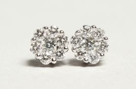 A PAIR OF 18CT WHITE GOLD AND DIAMOND CLUSTER EARRINGS, diamonds approx.0.5ct