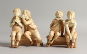 TWO AMUSING ROYAL WORCESTER BLUSH IVORY PORCELAIN GROUPS, each depicting two cheeky boys seated on a