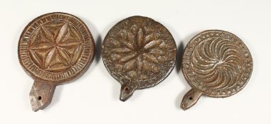 THREE CARVED WOOD CIRCULAR BUTTER MOULDS 4.5ins - 5ins diameter