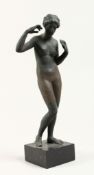AFTER THE ANTIQUE, A PAINTED MOULDED PLASTER FIGURE OF A STANDING FEMALE NUDE, on a square base