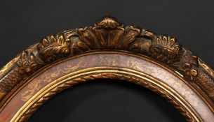 A 19th century oval frame with flowered cartouches and incised scrolling, rebate size 19.25 x 15 ,