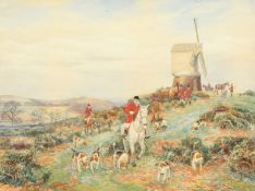 Arthur Foster, A foxhunting scene with huntsman and hounds in a country landscape with a windmill