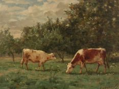 Louis Darey (1863-1914) French, Cows feeding in a tree-lined meadow, oil on mahogany panel,