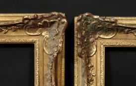 A pair of early 20th century gilt composition swept frames, rebate size 18 x 32 , 46cm x 81.5cm, (