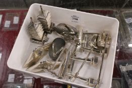 Five pairs of novelty Japanese silver cruets together with a pair of knife rests.