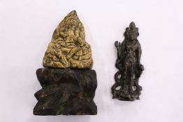 A bronze amulet and another item.