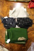 A green shawl with gold decoration together with a fine silk woven shawl and other items.
