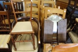 A Bergere style armchair a small chair and a folding mirror.