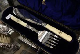 A cased set of plain silver fish servers.